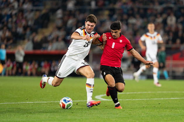 October 6, 2026, GER, Germany U21 vs. Georgia U21: A duel between Mert Kömür (Germany U21, No. 10) and Giorgi Robakidze (Georgia U21, No. 8) at the SchücoArena in Bielefeld, Germany Copyright: xnordphotoxGmbHx xChristianxSchulzex