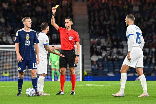 Scotland v Slovenia UEFA Nations League Erik Janza of Slovenia is shown a yellow card by the match referee Josà Maria Sanchez Santos during the UEFA Nations League match at Barclays Hampden, Glasgow 06 10 2026 UK Newspapers OUT Copyright: xJamiexJohnstonx FIL-24032-0064
