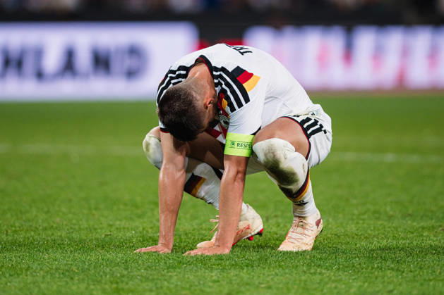 U-21 European Championship Qualifier: Germany vs. Georgia, October 6, 2026. Nicolò Tresoldi (Germany) lies on the ground after the final whistle. Soccer, U-21 European Championship Qualifier, Matchday 10: Germany vs. Georgia on October 6, 2026, Bielefeld DFB REGULATIONS PROHIBIT ANY USE OF PHOTOGRAPHS AS IMAGE SEQUENCES AND OR QUASI-VIDEO Copyright: xBEAUTIFULxSPORTS Tonhäuserx