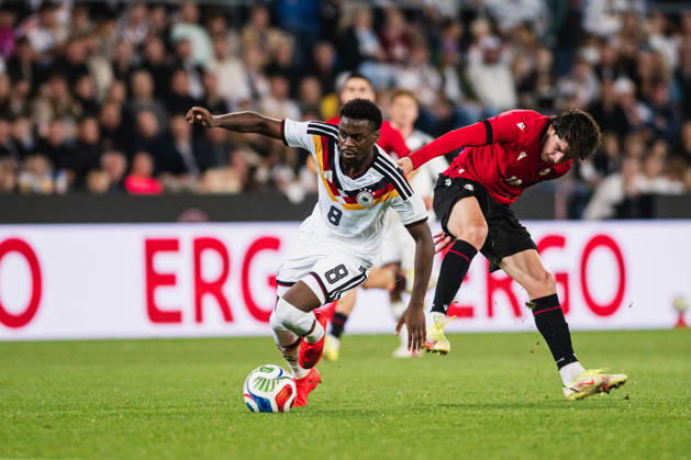 U-21 European Championship Qualifier: Germany vs. Georgia, October 6, 2026: Noel Aseko (Germany, No. 8) passes Nikoloz Dadiani (Georgia, No. 10). Soccer, U-21 European Championship Qualifiers, Matchday 10: Germany vs. Georgia on October 6, 2026, Bielefeld DFB REGULATIONS PROHIBIT ANY USE OF PHOTOGRAPHS AS IMAGE SEQUENCES AND OR QUASI-VIDEO Copyright: xBEAUTIFULxSPORTS Tonhäuserx