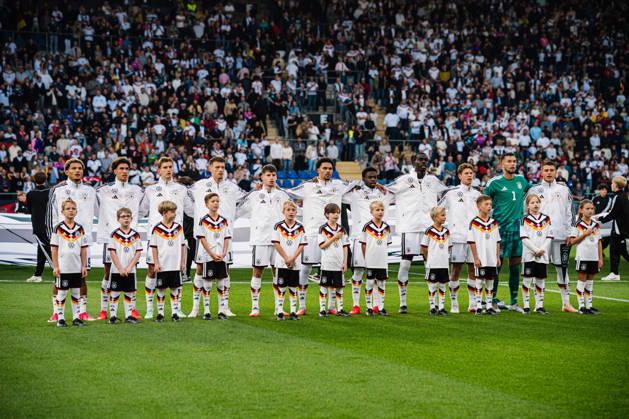 U21 European Championship Qualifier: Germany vs. Georgia, October 6, 2026; Germany during the national anthem: Paris Brunner (Germany), 19; Noah Darvich (Germany), 17; Aljoscha Kemlein (Germany), 16; Dženan Pejcinovic, Germany, 11, Nnamdi Collins, Germany, 20, Noel Aseko, Germany, 8, Joshua Quarshie, Germany, 5, Lukas Ullrich, Germany, 3, Elias Baum, Germany, 2, Mio Backhaus, Germany, 1, Nicolò Tresoldi Germany, 9 Soccer, U-21 European Championship Qualifiers, Matchday 10: Germany vs. Georgia on October 6, 2026, Bielefeld DFB REGULATIONS PROHIBIT ANY USE OF PHOTOGRAPHS AS IMAGE SEQUENCES AND OR QUASI-VIDEO Copyright: xBEAUTIFULxSPORTS Tonhäuserx