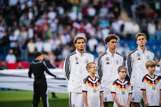 U-21 European Championship Qualifier: Germany vs. Georgia, October 6, 2026; Germany during the national anthem; Paris Brunner (Germany), 19; Noah Darvich (Germany), 17; Leandro Morgalla (Germany), 6; Soccer; U-21 European Championship Qualifier; Matchday 10: Germany vs. Georgia on October 6, 2026, Bielefeld. DFB regulations prohibit any use of photographs as image sequences and or quasi-video. Copyright: xBEAUTIFULxSPORTS Tonhäuserx