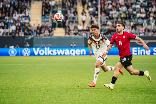 U-21 European Championship Qualifier: Germany vs. Georgia, October 6, 2026; Noah Darvich (Germany), 17; Aleko Basiladze (Georgia), 14; Soccer; U-21 European Championship Qualifier, Matchday 10: Germany vs. Georgia on October 6, 2026; Bielefeld DFB REGULATIONS PROHIBIT ANY USE OF PHOTOGRAPHS AS IMAGE SEQUENCES AND OR QUASI-VIDEO Copyright: xBEAUTIFULxSPORTS Tonhäuserx