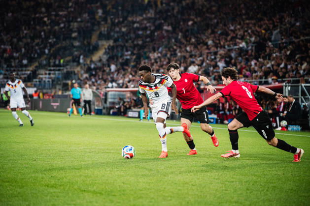 U-21 European Championship Qualifier: Germany vs. Georgia, October 6, 2026: Noel Aseko (Germany), 8, vs. Vakhtang Salia (Georgia), 7, and Dato Bukia (Georgia), 3; Soccer, U-21 European Championship Qualifiers, Matchday 10: Germany vs. Georgia on October 6, 2026, Bielefeld DFB REGULATIONS PROHIBIT ANY USE OF PHOTOGRAPHS AS IMAGE SEQUENCES AND OR QUASI-VIDEO Copyright: xBEAUTIFULxSPORTS Tonhäuserx