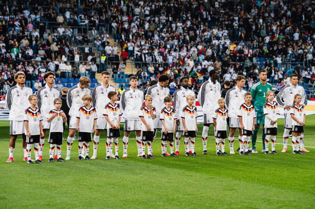 U21 European Championship Qualifier: Germany vs. Georgia, October 6, 2026; Germany during the national anthem: Paris Brunner (Germany), 19; Noah Darvich (Germany), 17; Aljoscha Kemlein (Germany), 16; Dženan Pejcinovic, Germany, 11, Nnamdi Collins, Germany, 20, Noel Aseko, Germany, 8, Joshua Quarshie, Germany, 5, Lukas Ullrich, Germany, 3, Elias Baum, Germany, 2, Mio Backhaus, Germany, 1, Nicolò Tresoldi Germany, 9 Soccer, U-21 European Championship Qualifiers, Matchday 10: Germany vs. Georgia on October 6, 2026, Bielefeld DFB REGULATIONS PROHIBIT ANY USE OF PHOTOGRAPHS AS IMAGE SEQUENCES AND OR QUASI-VIDEO Copyright: xBEAUTIFULxSPORTS Tonhäuserx