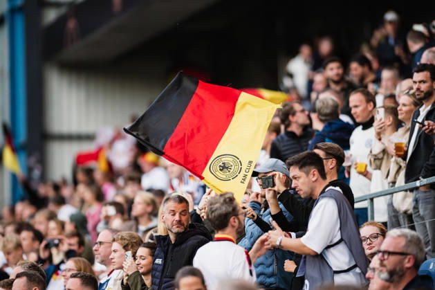 U-21 European Championship Qualifier: Germany vs. Georgia, October 6, 2026—A German flag is waved in the crowd. Soccer, U-21 European Championship Qualifier, Matchday 10: Germany vs. Georgia on October 6, 2026, Bielefeld DFB REGULATIONS PROHIBIT ANY USE OF PHOTOGRAPHS AS IMAGE SEQUENCES AND OR QUASI-VIDEO Copyright: xBEAUTIFULxSPORTS Tonhäuserx