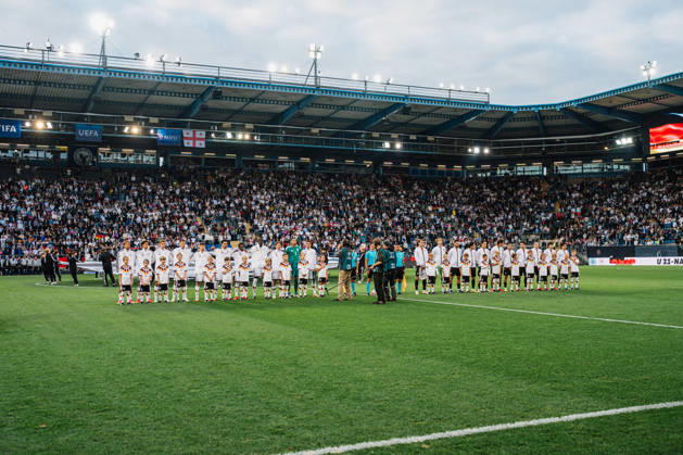 U21 European Championship Qualifier: Germany vs. Georgia, October 6, 2026; Germany during the national anthem: Paris Brunner (Germany), 19; Noah Darvich (Germany), 17; Aljoscha Kemlein (Germany), 16; Dženan Pejcinovic, Germany, 11, Nnamdi Collins, Germany, 20, Noel Aseko, Germany, 8, Joshua Quarshie, Germany, 5, Lukas Ullrich, Germany, 3, Elias Baum, Germany, 2, Mio Backhaus, Germany, 1, Nicolò Tresoldi Germany, 9 with Georgia, Papuna Beruashvili Georgia, 23, Dato Bukia Georgia, 3, Aleksandre Narimanidze Georgia, 4, Aleksandre Amisulashvili (Georgia), 5, Dachi Lordkipanidze (Georgia), 6, Vakhtang Salia (Georgia), 7, Diego Deisadze (Georgia), 9, Nikoloz Dadiani (Georgia), 10, Halid Doltmourziev (Georgia), 13, Aleko Basiladze (Georgia), 14, Akaki Giunashvili (Georgia), 17 Soccer, U-21 European Championship Qualifiers, Matchday 10: Germany vs. Georgia on October 6, 2026, Bielefeld DFB REGULATIONS PROHIBIT ANY USE OF PHOTOGRAPHS AS IMAGE SEQUENCES AND OR QUASI-VIDEO Copyright: xBEAUTIFULxSPORTS Tonhäuserx