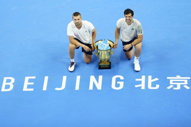 October 6, 2026, Beijing, China: Julian Cash and Lloyd Glasspool of Great Britain pose with their winner s trophy during the medal ceremony after winning against Sander Arends and David Pel of Netherlands (not in view) during the Men s Doubles final match on day seven of China Open at the National Tennis Center. Julian Cash and Lloyd Glasspool won, Final Score: 6-3, 3-6, 10-6 Beijing China - ZUMAs197 20261006_aaa_s197_256 Copyright: xPolyxFeix