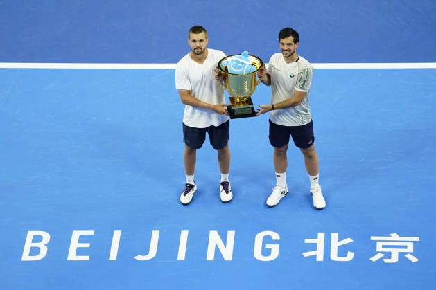 October 6, 2026, Beijing, China: Julian Cash and Lloyd Glasspool of Great Britain pose with their winner s trophy during the medal ceremony after winning against Sander Arends and David Pel of Netherlands (not in view) during the Men s Doubles final match on day seven of China Open at the National Tennis Center. Julian Cash and Lloyd Glasspool won, Final Score: 6-3, 3-6, 10-6 2026 China Open In Beijing - 06 Oct 2026  - ZUMAs197 20261006_aaa_s197_254 Copyright: xPolyxFeix