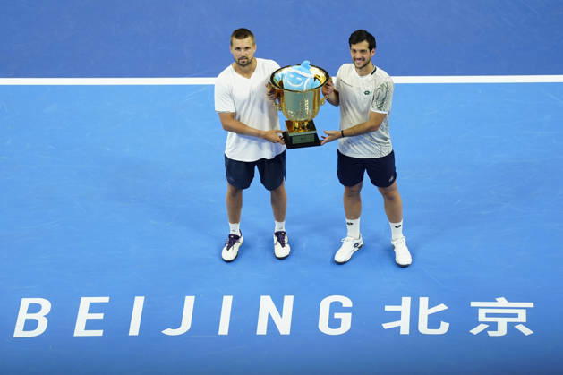 October 6, 2026, Beijing, China: Julian Cash and Lloyd Glasspool of Great Britain pose with their winner s trophy during the medal ceremony after winning against Sander Arends and David Pel of Netherlands (not in view) during the Men s Doubles final match on day seven of China Open at the National Tennis Center. Julian Cash and Lloyd Glasspool won, Final Score: 6-3, 3-6, 10-6 2026 China Open In Beijing - 06 Oct 2026  - ZUMAs197 20261006_aaa_s197_258 Copyright: xPolyxFeix