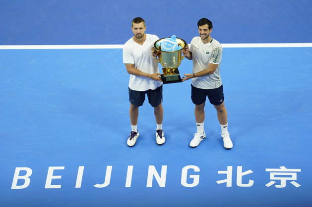 October 6, 2026, Beijing, China: Julian Cash and Lloyd Glasspool of Great Britain pose with their winner s trophy during the medal ceremony after winning against Sander Arends and David Pel of Netherlands (not in view) during the Men s Doubles final match on day seven of China Open at the National Tennis Center. Julian Cash and Lloyd Glasspool won, Final Score: 6-3, 3-6, 10-6 2026 China Open In Beijing - 06 Oct 2026  - ZUMAs197 20261006_aaa_s197_265 Copyright: xPolyxFeix