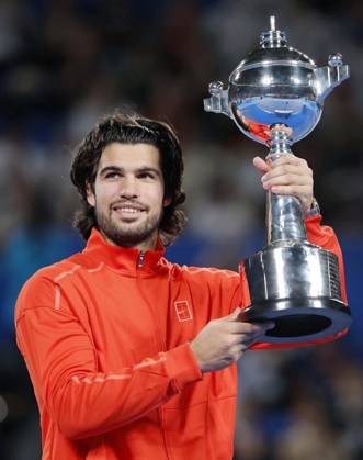 Tennis: Japan Open Carlos Alcaraz of Spain poses with the victor s trophy after winning the men s singles title at the Japan Open tennis tournament at Ariake Tennis Forest Park in Tokyo on Oct. 6, 2026. A14AA0005630268P