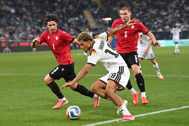 Paris BRUNNER (GER) vs. Dato BUKIA (GEO) and Aleksandre Amisulashvili (GEO) – Action, Tackle, International Soccer Match, U21, European Championship Qualifiers, Germany vs. Georgia 2–0 on October 6, 2026, Schueco Arena, Bielefeld, Â