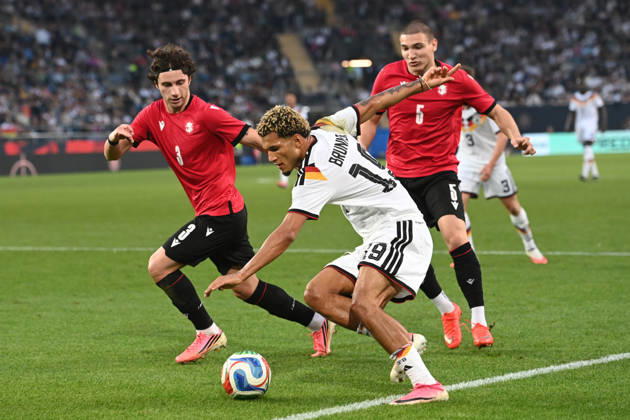 Paris BRUNNER (GER) vs. Dato BUKIA (GEO) and Aleksandre Amisulashvili (GEO) – Action, Tackle, International Soccer Match, U21, European Championship Qualifiers, Germany vs. Georgia 2–0 on October 6, 2026, Schüco Arena, Bielefeld, Â