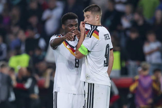 Noel Aseko (Germany) and Nicolo Tresoldi (Germany) talk during the UEFA Under-21 EURO qualifier between Germany U21 and Georgia U21 at Almstadion on October 6, 2026, in Bielefeld, Germany. Photo by Marco Steinbrenner, DeFodi Images