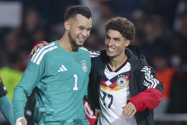 Goalkeepers Mio Backhaus (Germany) and Noah Darvich (Germany) cheer during the UEFA Under-21 EURO qualifier between Germany U21 and Georgia U21 at Almstadion on October 6, 2026, in Bielefeld, Germany. Photo by Marco Steinbrenner, DeFodi Images