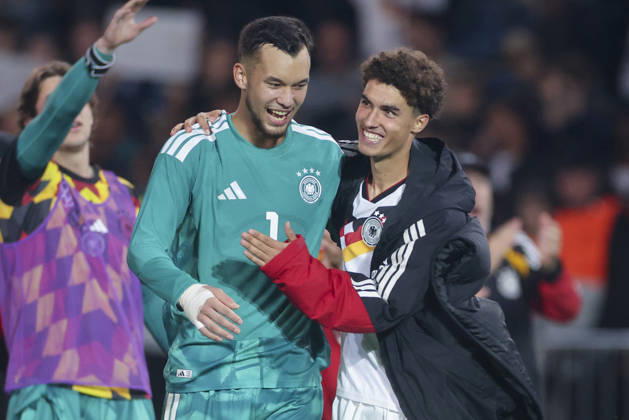 Goalkeepers Mio Backhaus (Germany) and Noah Darvich (Germany) cheer during the UEFA Under-21 EURO qualifier between Germany U21 and Georgia U21 at Almstadion on October 6, 2026, in Bielefeld, Germany. Photo by Marco Steinbrenner, DeFodi Images