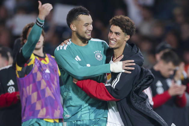 Goalkeepers Mio Backhaus (Germany) and Noah Darvich (Germany) cheer during the UEFA Under-21 EURO qualifier between Germany U21 and Georgia U21 at Almstadion on October 6, 2026, in Bielefeld, Germany. Photo by Marco Steinbrenner, DeFodi Images
