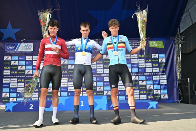 Denmark s Malthe Risbjerg; Spain s Benjamin Noval Suarez and Belgium s Vic De Smet celebrate on the podium of the Men Junior Individual Time Trial race (22km) at the cycling UEC Road European Championships, in Ljubljana, Slovenia, on Wednesday 7 October 2026. The UEC Road European Championships are taking place from 02 to 07 October in Ljubljana, Slovenia. DAVIDxPINTENS x189038015x
