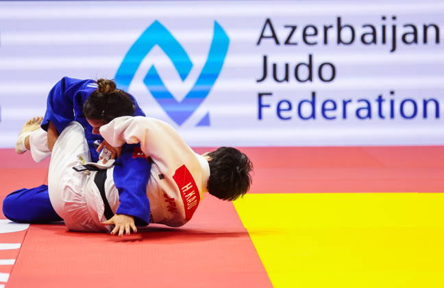 AZERBAIJAN, BAKU - OCTOBER 7, 2026: Kerem Primo (L) of Israel and Haruka Kaju of Japan compete in a -63 kg bout as part of the 2026 World Judo Championships at the National Gymnastics Arena. Mikhail Sinitsyn TASS  98913907