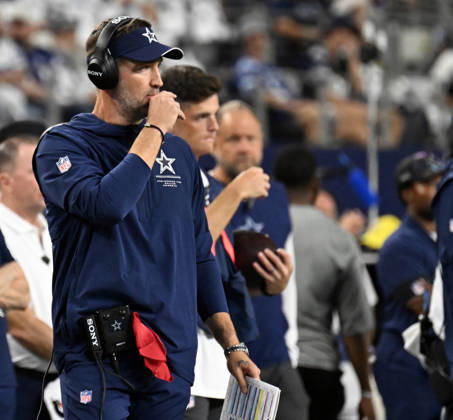Dallas Cowboys head coach Berian Schottenheimer calls plays against the Tampa Bay Buccaneers during their game at AT&T Stadium in Arlington, Texas on Thursday, October 8, 2026. ARL2026100818 IANxHALPERIN