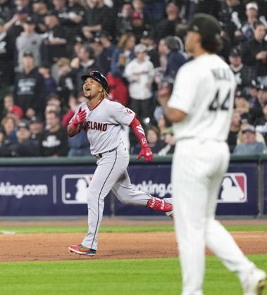 Baseball: Division Series between Guardians and White Sox Jose Ramirez (L) of the Cleveland Guardians celebrates after hitting a two-run home run as Chicago White Sox pitcher Hagen Smith (44) looks on in the fifth inning of Game 4 of the American League Division Series against the at Rate Field in Chicago on Oct. 8, 2026.  A14AA0005630521P