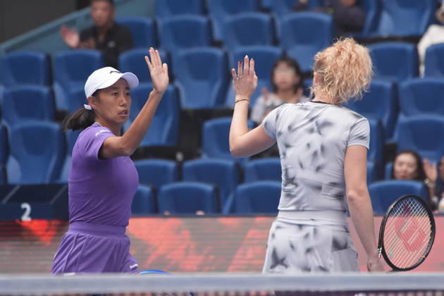 (261009) -- BEIJING, Oct. 9, 2026 -- Katerina Siniakova (R) Zhang Shuai celebrate scoring during the women s doubles quarterfinal match between Katerina Siniakova (the Cezch Republic) Zhang Shuai (China) and Storm Hunter (Australia) Kristina Mladenovic (France) at 2026 China Open tennis tournament in Beijing, China, Oct. 9, 2026. ) (SP)CHINA-BEIJING-TENNIS-CHINA OPEN-WOMEN S DOUBLES (CN) XiexHan