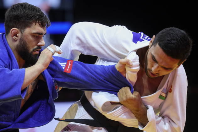 AZERBAIJAN, BAKU - OCTOBER 9, 2026: Gennaro Pirelli (L) of Italy and Tulkinbek Turdiev of Uzbekistan compete in their -100 kg bout as part of the 2026 World Judo Championships at the National Gymnastics Arena. Mikhail Sinitsyn TASS 98997264