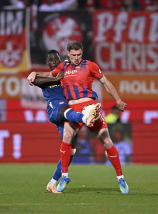 Tackle, Budu Zivzivadze Siwsiwadse of 1 FC Heidenheim 1846 (FCH) 11 vs. Maxwell Gyamfi of 1 FC Kaiserslautern (FCK) 04 1 FC Heidenheim 1846 (FCH) vs. 1 FC Kaiserslautern 09 10 2026 DFL regulations prohibit any use of photographs as image sequences and or quasi-video. 1 FC Heidenheim 1846 FCH vs. 1 FC Kaiserslautern