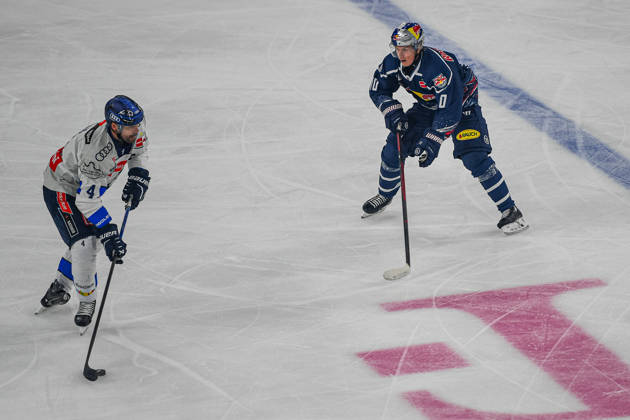 October 9, 2026, Munich, Germany PENNY DEL, German Ice Hockey League, 2026–27 season, Matchday 7: EHC Red Bull Munich vs. ERC Ingolstadt at SAP Garden in Munich; Elis Hede of EHC Red Bull Munich looks pensive, serious, and focused alongside Morgan Ellis of ERC Ingolstadt