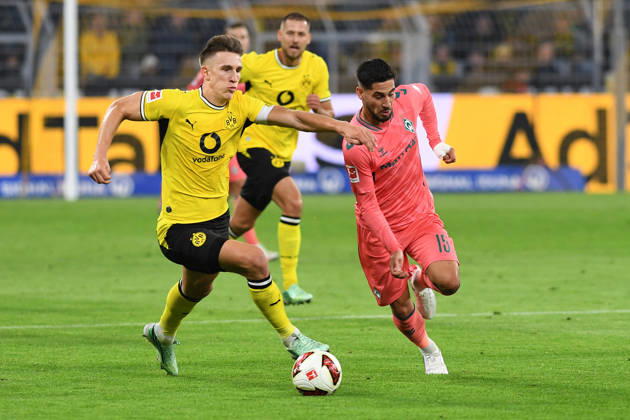 Nico Schlotterbeck of Borussia Dortmund and Ludovic Reis of Werder Bremen battle for the ball during the Bundesliga match between Borussia Dortmund and SV Werder Bremen at Signal Iduna Park on October 9, 2026, in Dortmund, Germany Photo by Ralf Treese, DeFodi Images Nico Schlotterbeck of Borussia Dortmund and Ludovic Reis of Werder Bremen battle for the ball during the Bundesliga match between Borussia Dortmund and SV Werder Bremen at Signal Iduna Park on October 9, 2026 in Dortmund, Germany. Photo by Ralf Treese, DeFodi Images. DFB and DFL regulations prohibit any use of photographs as image sequences and or quasi-video. Photo by Ralf Treese, DeFodi Images.