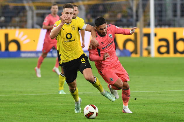 Nico Schlotterbeck of Borussia Dortmund and Ludovic Reis of Werder Bremen battle for the ball during the Bundesliga match between Borussia Dortmund and SV Werder Bremen at Signal Iduna Park on October 9, 2026, in Dortmund, Germany Photo by Ralf Treese, DeFodi Images Nico Schlotterbeck of Borussia Dortmund and Ludovic Reis of Werder Bremen battle for the ball during the Bundesliga match between Borussia Dortmund and SV Werder Bremen at Signal Iduna Park on October 9, 2026 in Dortmund, Germany. Photo by Ralf Treese, DeFodi Images. DFB and DFL regulations prohibit any use of photographs as image sequences and or quasi-video. Photo by Ralf Treese, DeFodi Images.