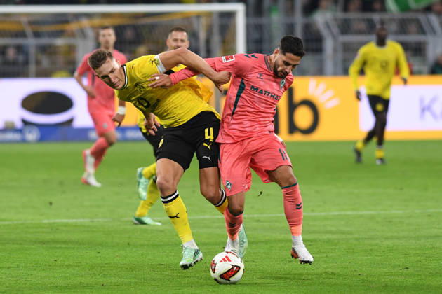 Nico Schlotterbeck of Borussia Dortmund and Ludovic Reis of Werder Bremen battle for the ball during the Bundesliga match between Borussia Dortmund and SV Werder Bremen at Signal Iduna Park on October 9, 2026, in Dortmund, Germany Photo by Ralf Treese, DeFodi Images Nico Schlotterbeck of Borussia Dortmund and Ludovic Reis of Werder Bremen battle for the ball during the Bundesliga match between Borussia Dortmund and SV Werder Bremen at Signal Iduna Park on October 9, 2026 in Dortmund, Germany. Photo by Ralf Treese, DeFodi Images. DFB and DFL regulations prohibit any use of photographs as image sequences and or quasi-video. Photo by Ralf Treese, DeFodi Images.