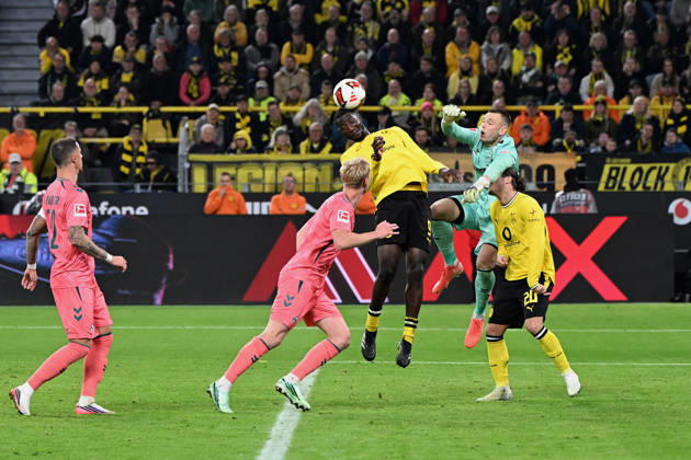Serhou Guirassy of Borussia Dortmund and goalkeeper Karl Hein of Werder Bremen battle for the ball during the Bundesliga match between Borussia Dortmund and SV Werder Bremen at Signal Iduna Park on October 9, 2026, in Dortmund, Germany. Photo by Ralf Treese, DeFodi Images. Serhou Guirassy of Borussia Dortmund and goalkeeper Karl Hein of Werder Bremen battle for the ball during the Bundesliga match between Borussia Dortmund and SV Werder Bremen at Signal Iduna Park on October 9, 2026 in Dortmund, Germany. Photo by Ralf Treese, DeFodi Images. DFB and DFL regulations prohibit any use of photographs as image sequences and or quasi-video. Photo by Ralf Treese, DeFodi Images