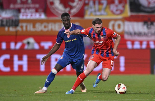 Tackle, Budu Zivzivadze Siwsiwadse of 1 FC Heidenheim 1846 (FCH) 11 vs. Maxwell Gyamfi of 1 FC Kaiserslautern (FCK) 04 1 FC Heidenheim 1846 (FCH) vs. 1 FC Kaiserslautern 09 10 2026 DFL regulations prohibit any use of photographs as image sequences and or quasi-video. 1 FC Heidenheim 1846 FCH vs. 1 FC Kaiserslautern