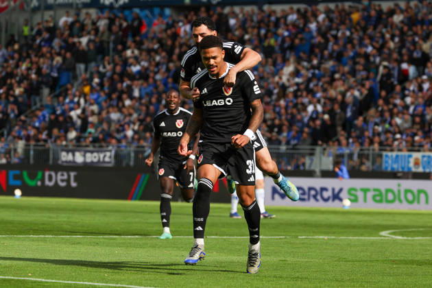 October 10, 2026, Soccer, 2. Bundesliga, SV Darmstadt 98 vs. Energie Cottbus, from left: Tolcay Cigereci (Energie Cottbus) and Justin Butler (Energie Cottbus) are seen celebrating after scoring a goal to make the score 0–1 Copyright: HMBxMedia JoaquimxFerreira
