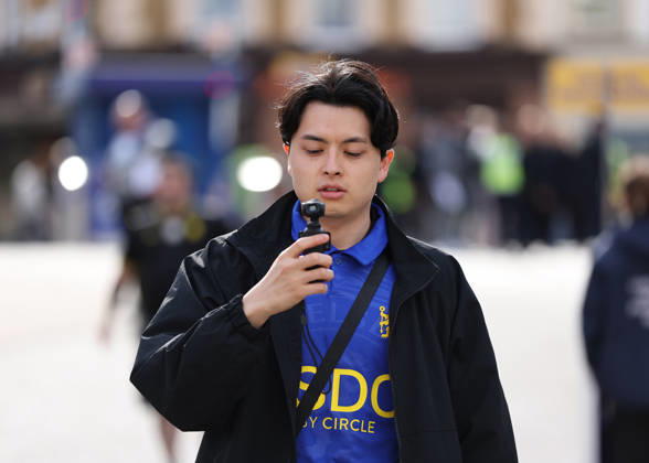 10th October 2026; Stamford Bridge, London, England; Premier League Football, Chelsea versus Bournemouth; A fan wearing a Chelsea home shirt using a DJI Osmo Pocket device to record his arrival at Stamford Bridge for social media JohnxPatrickxFletcher