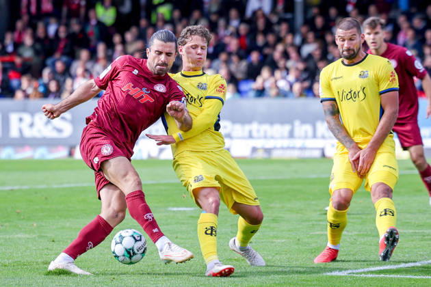 October 10, 2026, xsefx, Soccer, SC Fortuna Köln vs. 1 FC Saarbrücken, 3. Liga, Südstation, Matchday 8, 2026–2027 Season Daniel Gleiber of 1 FC Saarbrücken 05 in a tackle against David Haider, Kamm, and Al Azzawe, Fortuna Cologne 15. DFB regulations prohibit any use of photographs as image sequences and or quasi-video. North Rhine-Westphalia, Germany