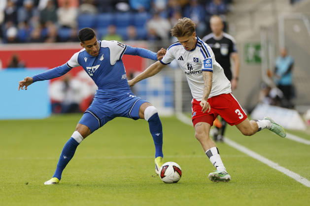 From left to right: Adam Daghim of TSG Hoffenheim and David Moller Wolfe of HSV, in the Bundesliga match between TSG 1899 Hoffenheim and Hamburger SV at the PreZero Arena, Sinsheim, Germany, on October 10, 2026, in action during the Bundesliga match between TSG 1899 Hoffenheim and Hamburger SV at the PreZero Arena, Sinsheim, Germany, on October 10, 2026. DFB and DFL regulations prohibit any use of photographs as image sequences and or quasi-video, Copyright: HMBxMedia xHeikoxBecker