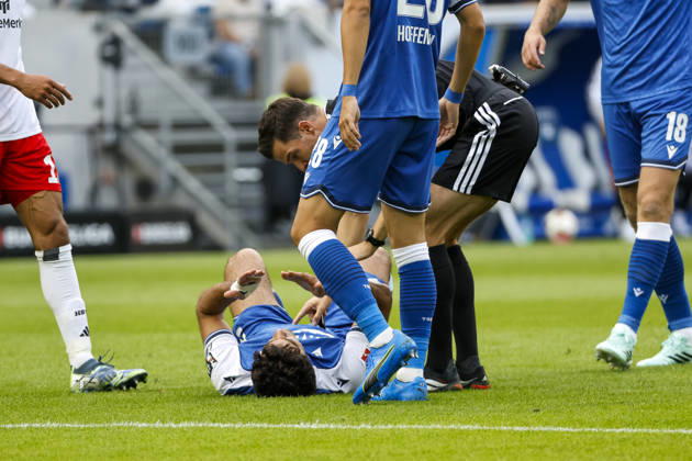 Ozan Kabak of TSG Hoffenheim, No. 05, injured on the ground, Germany, soccer, Bundesliga 1, Matchday 5, 2026–2027, TSG Hoffenheim vs. Hamburger SV, October 10, 2026, Sinsheim SNP Arena, Germany Copyright: xGrantxHubbsx