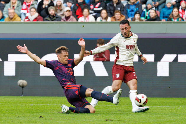 Arijon Ibrahimovic 21, FC Augsburg, and Joshua Kimmich 6, FC Bayern Munich, during the match between FC Augsburg and FC Bayern Munich, soccer, men s, Bundesliga, 2026–2027, Matchday 5 on October 10, 2026, in Augsburg, WWK ARENA. DFL and DFB regulations prohibit any use of photographs as image sequences and or quasi-video. Bayern, Germany