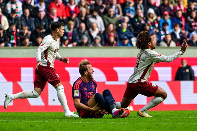 October 10, 2026, Germany, Soccer, Men s, Bundesliga 1, Matchday 5, FC Augsburg vs. FC Bayern Munich; Han Noah Massengo (FC Augsburg) scores 4 goals; Harry Kane (Bayern Munich) takes a shot to the calf; Augsburg WWK Arena, Bayern, Germany Copyright: xNordphotox xHafnerx