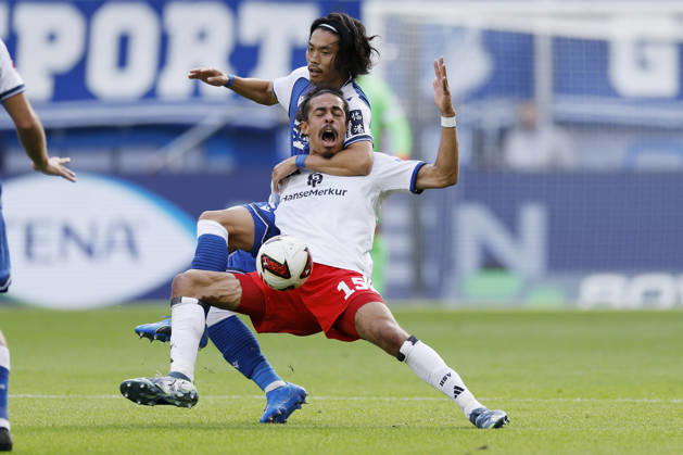 From left to right: Koki Machida of TSG Hoffenheim and Yussuf Poulsen of HSV, in the Bundesliga match between TSG 1899 Hoffenheim and Hamburger SV at the PreZero Arena, Sinsheim, Germany, on October 10, 2026, in action during the Bundesliga match between TSG 1899 Hoffenheim and Hamburger SV at the PreZero Arena, Sinsheim, Germany, on October 10, 2026. DFB and DFL regulations prohibit any use of photographs as image sequences and or quasi-video, Copyright: HMBxMedia xHeikoxBecker