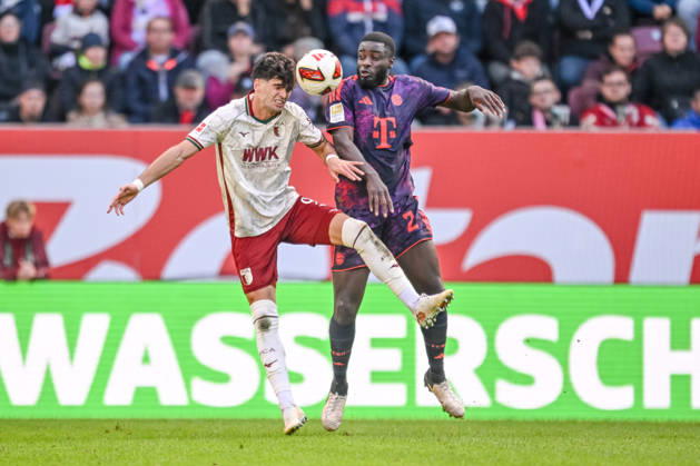 Rodrigo Ribeiro of FC Augsburg and Dayot Upamecano of FC Bayern Munich in a tackle during the Bundesliga match between FC Augsburg and FC Bayern Munich, at WWK Arena on October 10, 2026, in Augsburg, Germany. Photo by Harry Langer, DeFodi Images. Rodrigo Ribeiro of FC Augsburg and Dayot Upamecano of FC Bayern Munich battle for the ball during the Bundesliga match between FC Augsburg and FC Bayern Munich at WWK Arena on October 10, 2026 in Augsburg, Germany. Photo by Harry Langer, DeFodi Images. DFB and DFL regulations prohibit any use of photographs as image sequences and or quasi-video. Photo by Harry Langer, DeFodi Images. DFB and DFL regulations prohibit any use of photographs as imSEQUENCES AND OR QUASI-VIDEO