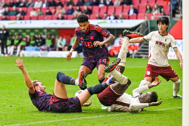 October 10, 2026, GER, Soccer, Men s, Bundesliga 1, Matchday 5, FC Augsburg vs. FC Bayern Munich: Luis Diaz (Bayern Munich), 14, in possession; Harry Kane (Bayern Munich), 9; and Juma Bah (FC Augsburg), 35, lying on their backs after a battle for the ball at the WWK Arena in Augsburg, Bavaria, Germany Copyright: xNordphotox xHafnerx