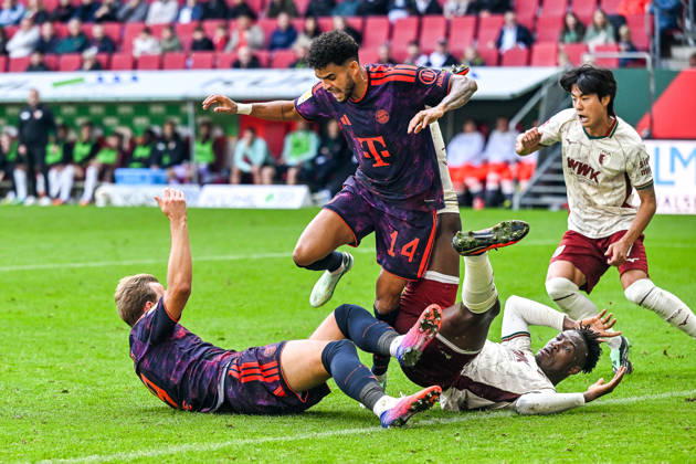 October 10, 2026, GER, Soccer, Men s, Bundesliga 1, Matchday 5, FC Augsburg vs. FC Bayern Munich: Luis Diaz (Bayern Munich), 14, in possession; Harry Kane (Bayern Munich), 9; and Juma Bah (FC Augsburg), 35, lying on their backs after a battle for the ball at the WWK Arena in Augsburg, Bavaria, Germany Copyright: xNordphotox xHafnerx