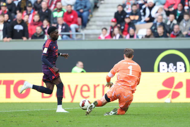 Manuel Neuer, FC Bayern Munich, No. 01, with Alphonso Davies, FC Bayern Munich, No. 19, GER, FC Augsburg vs. FC Bayern Munich, Soccer, Bundesliga, Matchday 5, 2026–2027 Season, October 10, 2026, DFL and DFB regulations prohibit any use of photographs as image sequences and or quasi-video, GER, FC Augsburg vs. FC Bayern Munich, soccer, Bundesliga, Matchday 5, 2026–2027 season, October 10, 2026, Augsburg Copyright: xEibner-Pressefoto JennixMaulx EP_JML