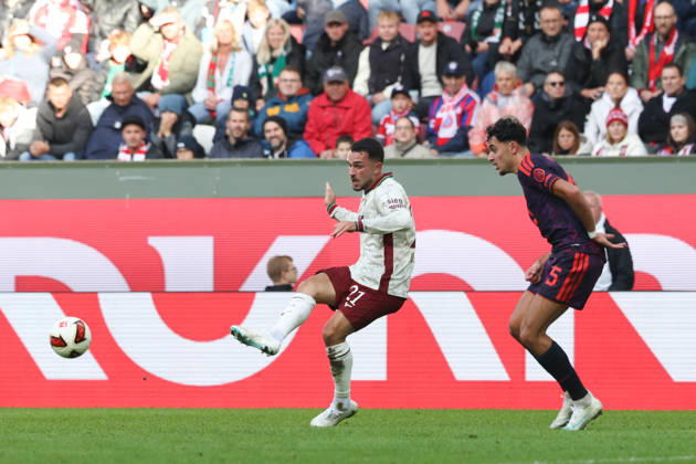 Arijon Ibrahimovic (FC Augsburg), 21, with Aleksandar Pavlovic (FC Bayern Munich), 45, GER, FC Augsburg vs. FC Bayern Munich, Soccer, Bundesliga, Matchday 5, 2026–2027 Season, October 10, 2026, DFL and DFB regulations prohibit any use of photographs as image sequences and or quasi-video, GER, FC Augsburg vs. FC Bayern Munich, soccer, Bundesliga, Matchday 5, 2026–2027 season, October 10, 2026, Augsburg Copyright: xEibner-Pressefoto JennixMaulx EP_JML