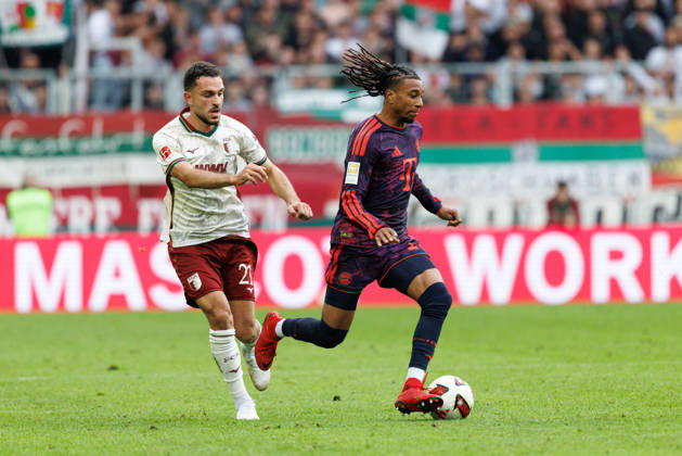 Michael Olise, 17, FC Bayern Munich, and Arijon Ibrahimovic, 21, FC Augsburg, during the match between FC Augsburg and FC Bayern Munich, soccer, men s, Bundesliga, 2026–2027, Matchday 5 on October 10, 2026, in Augsburg, WWK ARENA. DFL and DFB regulations prohibit any use of photographs as image sequences and or quasi-video. Bayern, Germany
