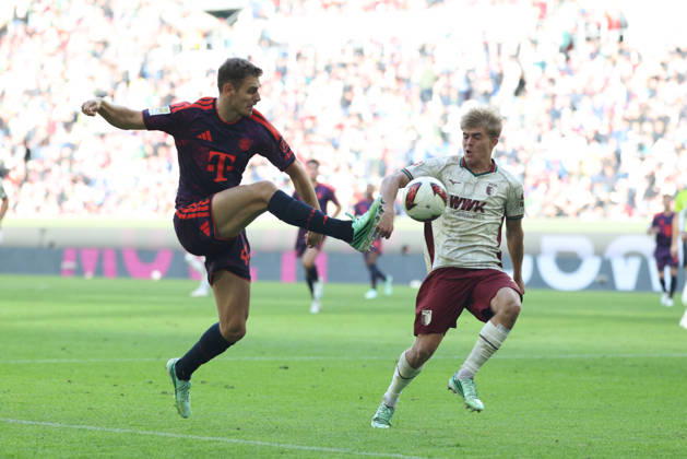 Josip Stanisic, FC Bayern Munich, 44, with Hennes Behrens, FC Augsburg, 16, GER, FC Augsburg vs. FC Bayern Munich, Soccer, Bundesliga, Matchday 5, 2026–2027 Season, October 10, 2026, DFL and DFB regulations prohibit any use of photographs as image sequences and or quasi-video, GER, FC Augsburg vs. FC Bayern Munich, soccer, Bundesliga, Matchday 5, 2026–2027 season, October 10, 2026, Augsburg Copyright: xEibner-Pressefoto JennixMaulx EP_JML